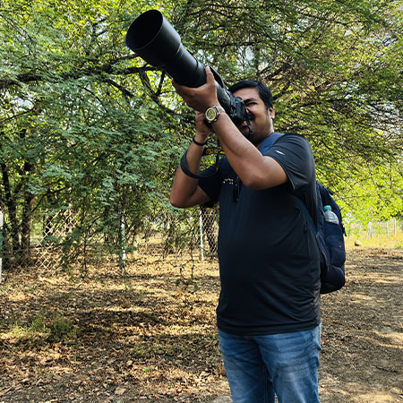 A-Bird-Photographer-trying-to-capture-photographs of Birds